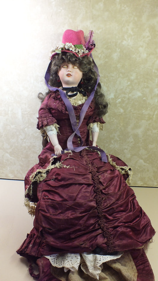 Vintage Porcelain Doll in a Victorian-style gown